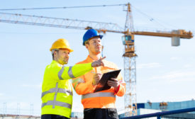 construction engineers near a crane