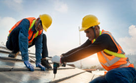 construction workers on a roof