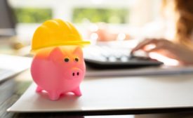 piggy bank with a construction hat