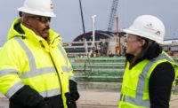 Charles Davis, Superintendent of Waller Corp., talks with another worker on the site of Pittsburgh International Airport’s modernization program.