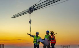 construction workers and a crane