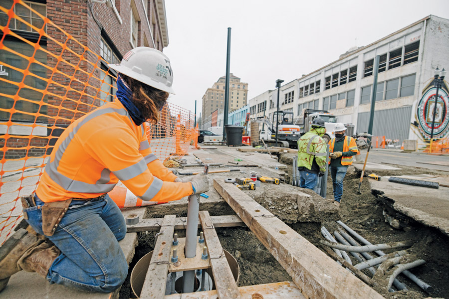 Workers prepare to lay track