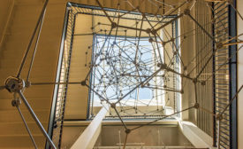 Antony Gormley sculpture up to skylight