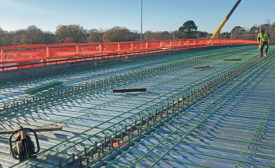 workers preparing a bridge with rebar