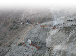 Building access road to tunnel head required steep retaining walls.